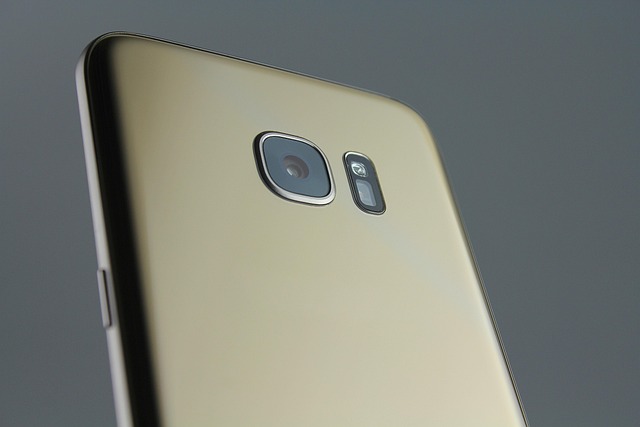 Mobile phone showing live security camera feed of home exterior